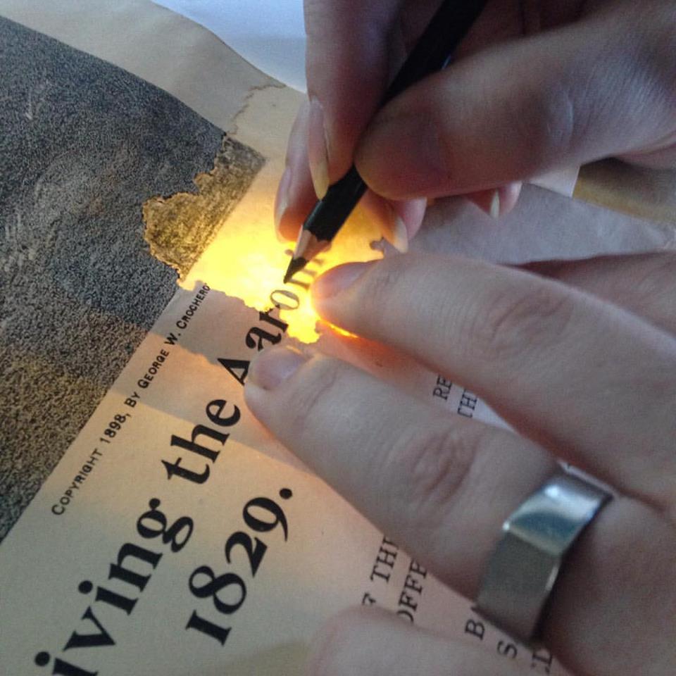 19th C. paper restoration, filling in missing letters.